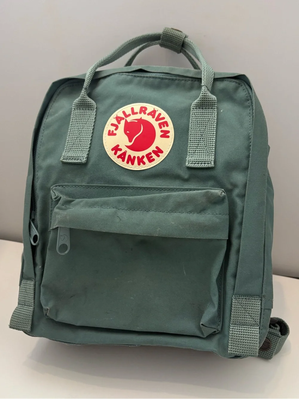 Fjallraven Kanken Mini Backpack in Sage Green with Red Logo